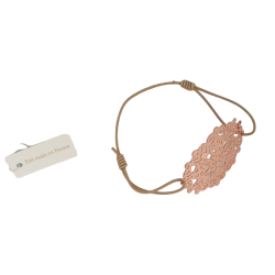 Bracelet élastique beige avec rosace en métal doré