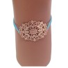 Bracelet élastique turquoise avec rosace en métal doré